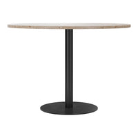 Round table with a natural stone top and a sleek black metal base, showcasing a minimalistic and modern design.