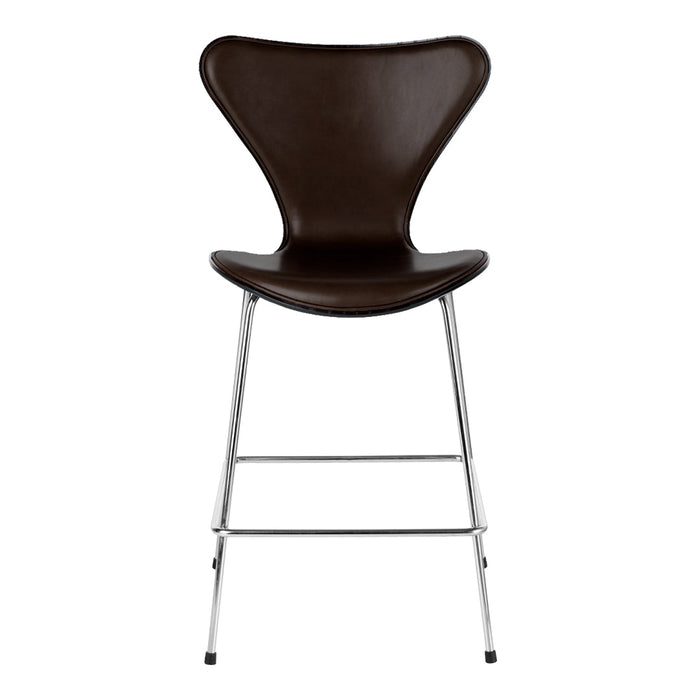 Brown upholstered bar stool with a sleek chrome base and a modern, curved design. Ideal for contemporary spaces.