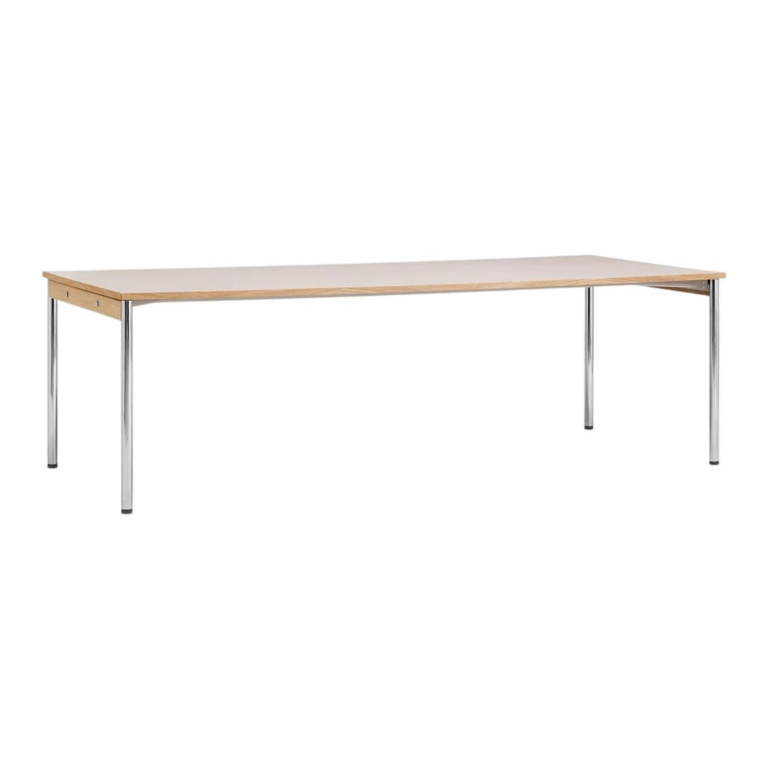 Light wood tabletop with a smooth finish, supported by sleek chrome legs; minimalistic design in neutral tones.