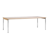 Light wood tabletop with a smooth finish, supported by sleek chrome legs; minimalistic design in neutral tones.
