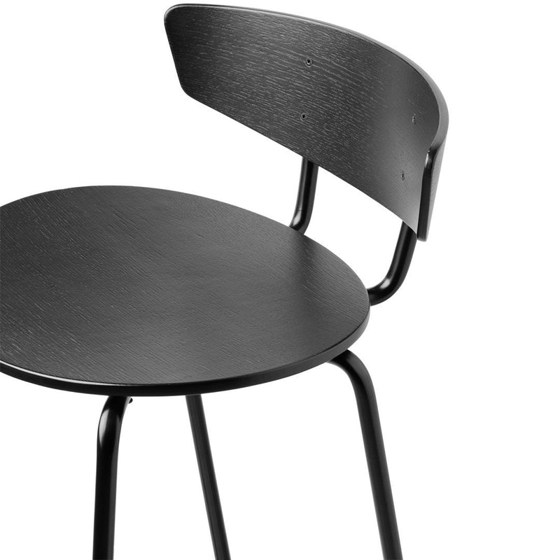 Black wooden stool featuring a smooth circular seat and curved backrest, complemented by sleek black metal legs.