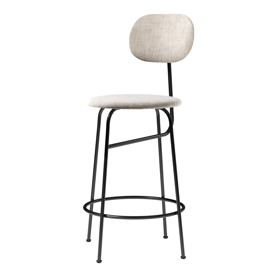 Beige upholstered bar stool with a sleek black metal frame, featuring a minimalist design and smooth contours.
