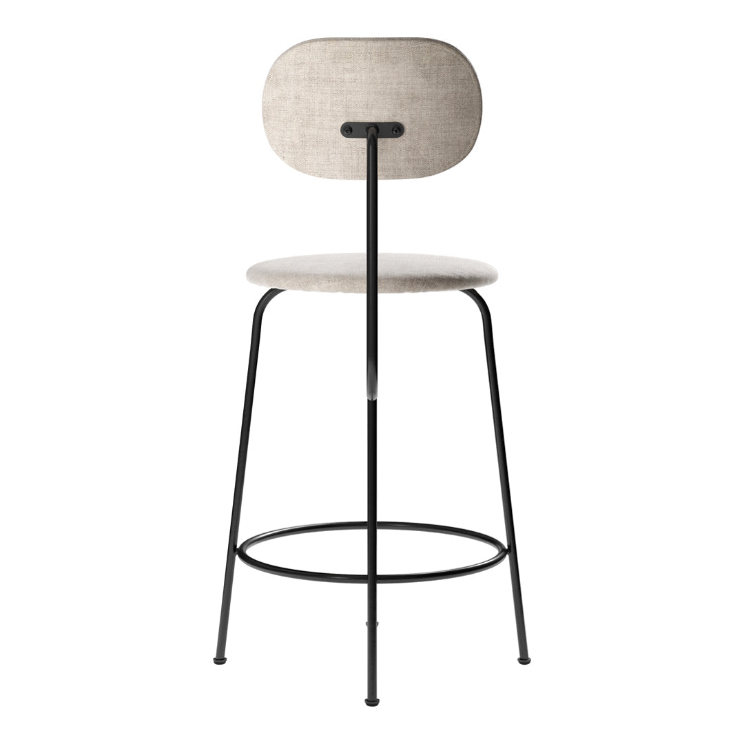 Modern bar stool with a light beige fabric seat and a simple black metal frame. Elegant and minimalistic design.
