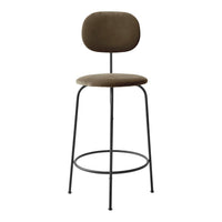 Stylish brown upholstered bar stool with a minimalist black metal frame and a smooth, rounded design.