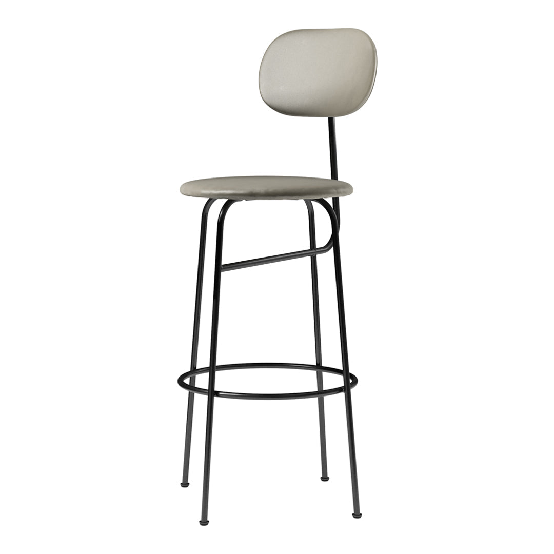 Neutral gray upholstered bar stool with sleek black metal legs, featuring a minimalist design and simple round patterns.