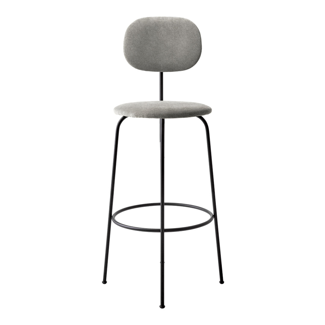 Gray upholstered bar stool with a minimalist design and sleek black metal legs. Perfect for modern decor.