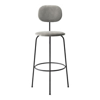 Gray upholstered bar stool with a minimalist design and sleek black metal legs. Perfect for modern decor.