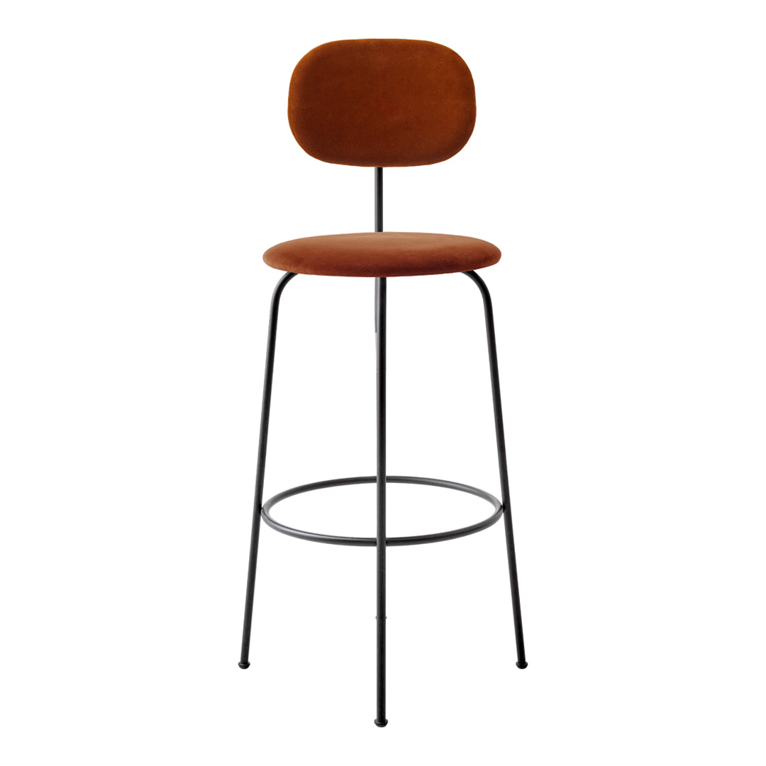 Copper velvet bar stool with a sleek black metal frame, featuring a smooth, minimalist design.
