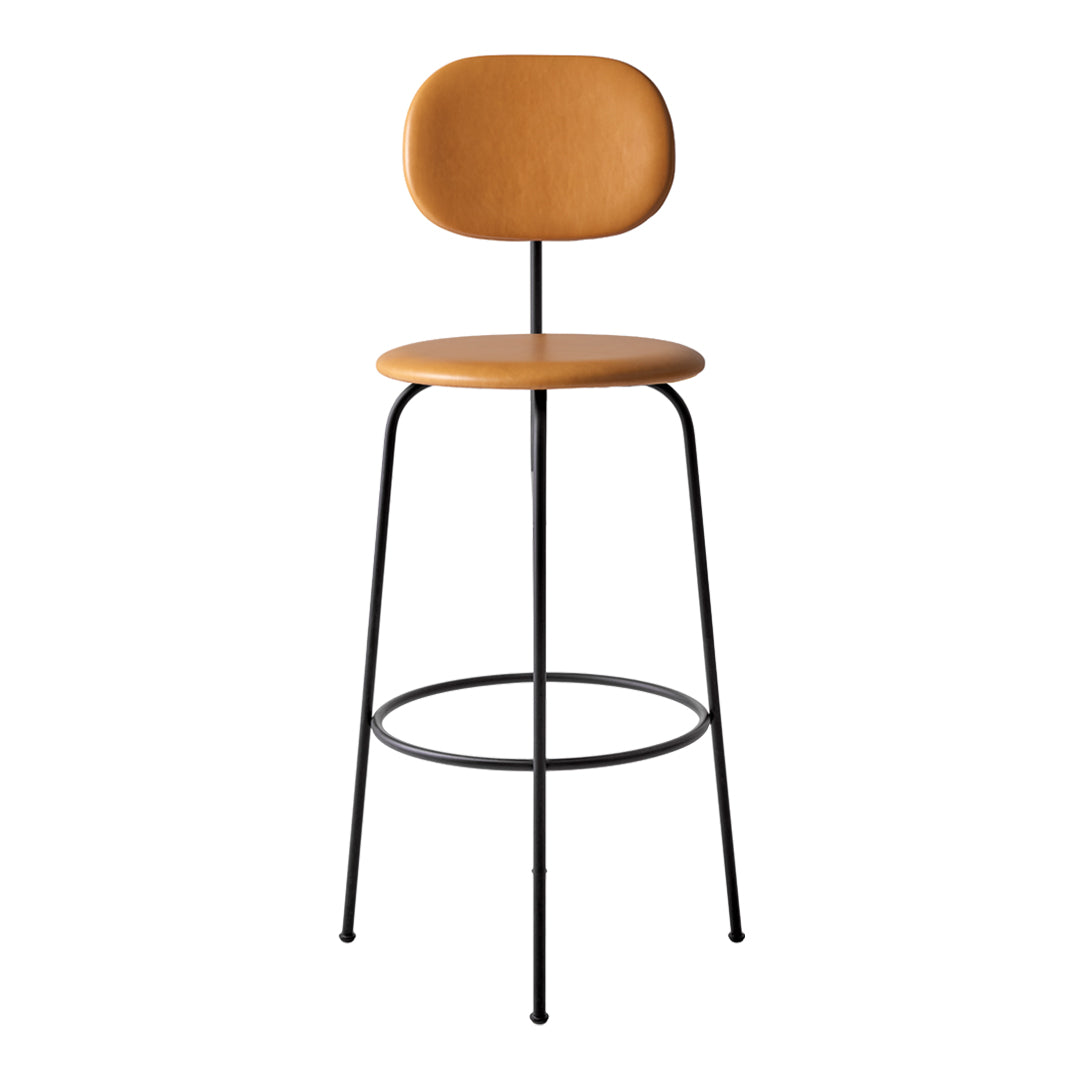 Tan seat and backrest on a sleek black metal frame, featuring a minimalist design for modern decor.