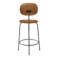 Tan upholstered bar stool with a minimalistic black metal frame and smooth, curved seat design.