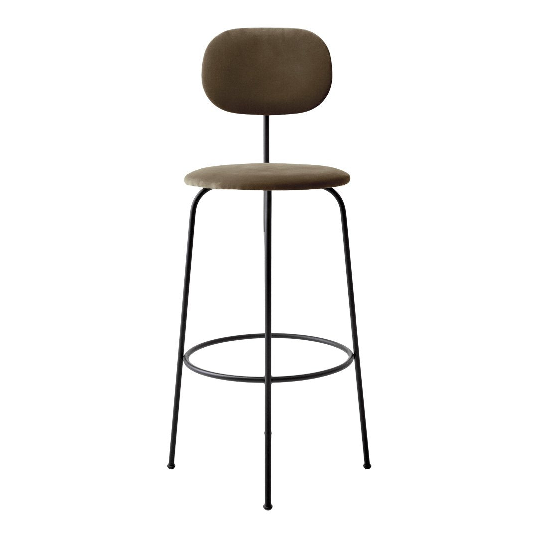 Stylish bar stool in muted olive green with a sleek black metal frame and minimalist design. Perfect for modern decor.