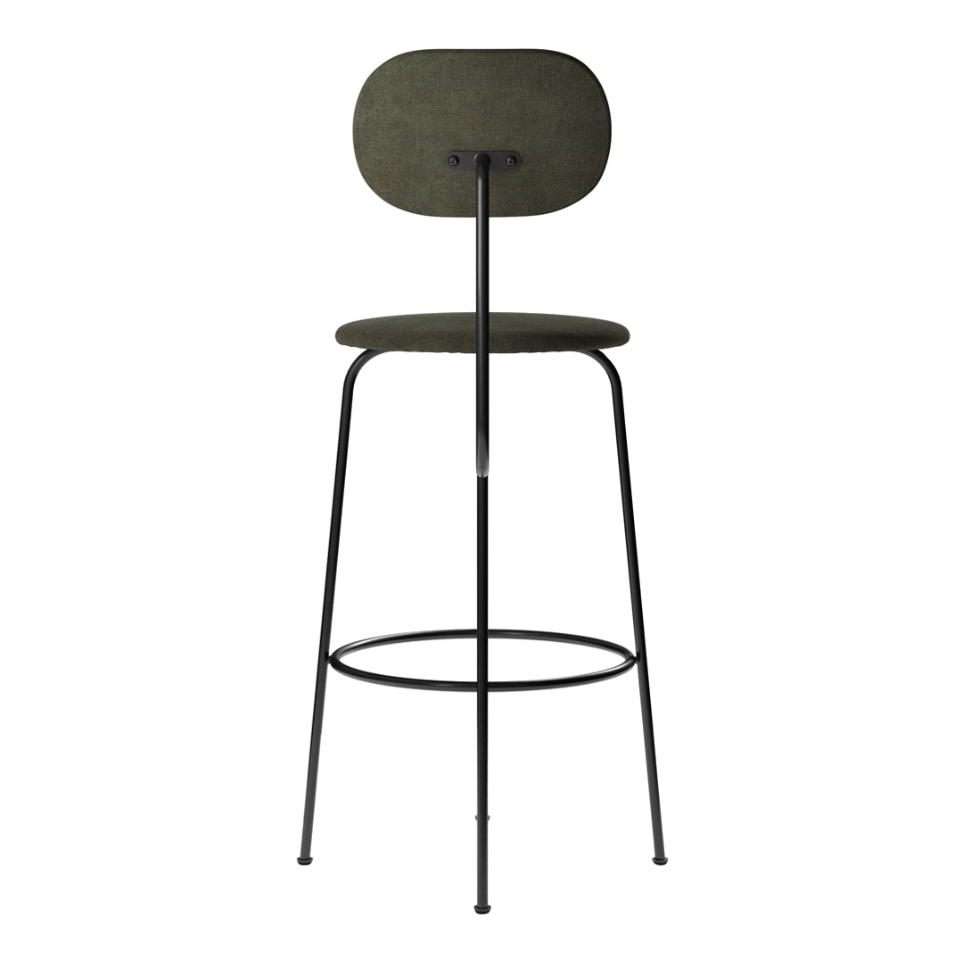 Green fabric bar stool with a smooth, rounded backrest and sleek black metal legs. Minimalist design and contemporary style.