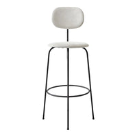 Neutral white seat with a smooth finish, paired with sleek black metal legs for a modern contrast.