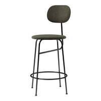 Green upholstered bar stool with a minimalist black metal frame and smooth, rounded design. Perfect for modern interiors.