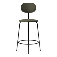 Stylish green fabric bar stool with a minimalist black metal frame and smooth, rounded design. Ideal for modern decor.