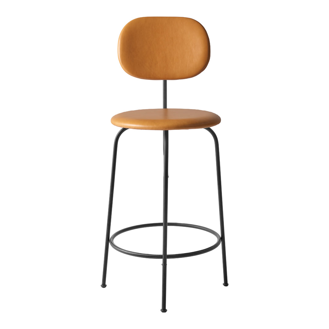 Modern bar stool featuring a warm tan seat, sleek black metal legs, and a minimalistic design. Perfect for stylish spaces.