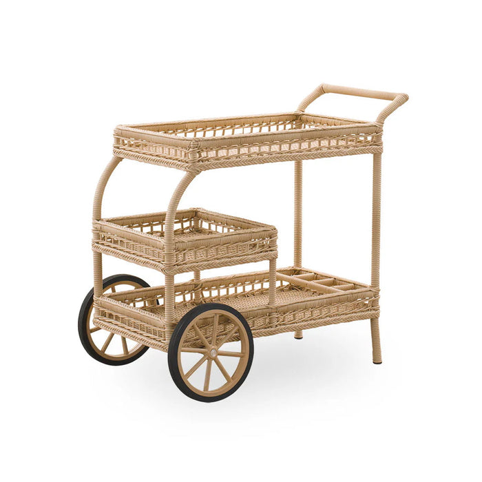 Natural woven rattan cart in light beige with intricate patterns and vintage-style wheels.