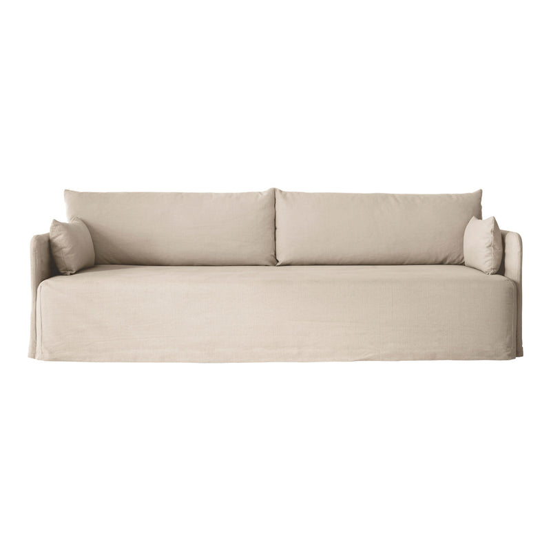 Beige, minimalist sofa with textured fabric and soft, inviting cushions, perfect for modern living spaces.