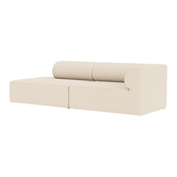 Cream-colored minimalist sofa with smooth, round cushions and a sleek design. Perfect for modern decor.