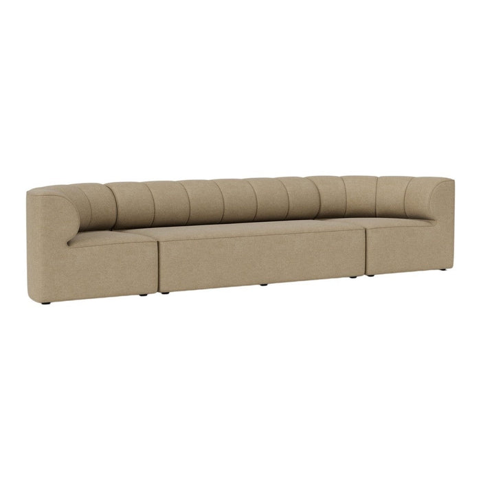 Beige curved sofa with horizontal tufted pattern, suitable for modern living spaces.