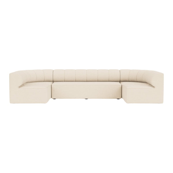 Beige upholstered sectional sofa with subtle stitched detailing and smooth, minimalist design. Perfect for modern decor.