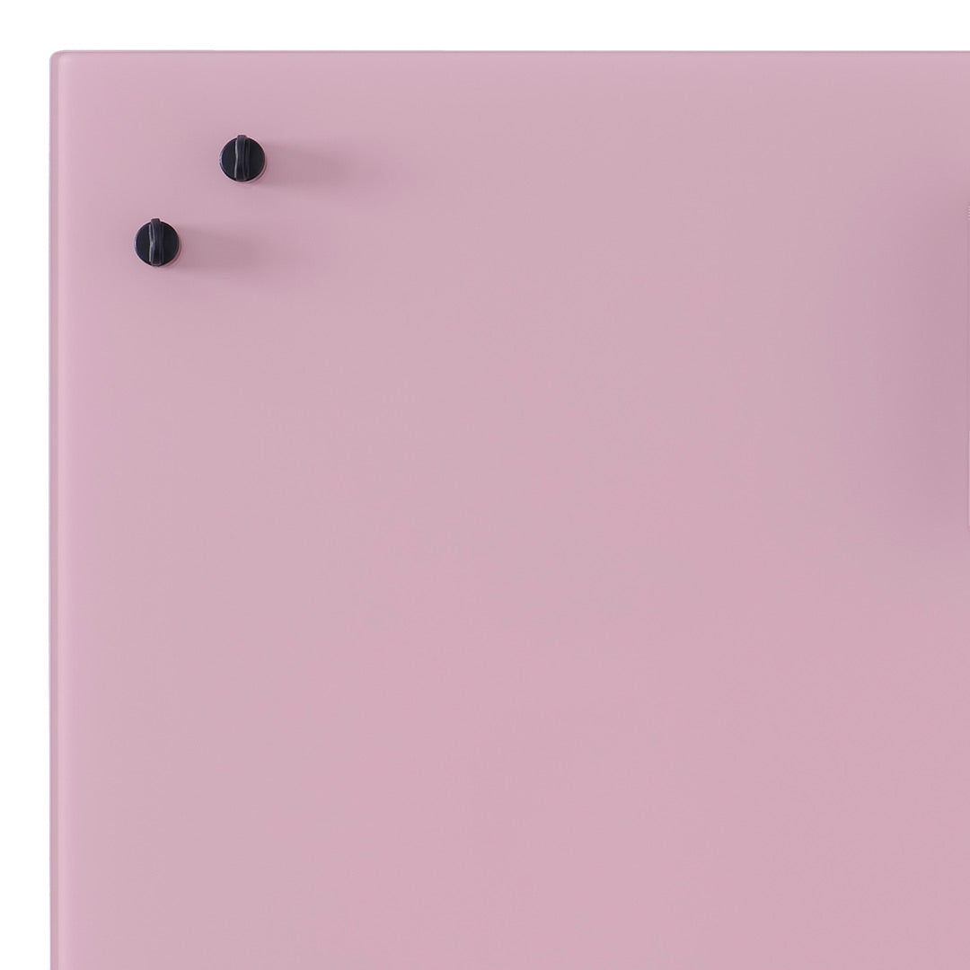 Pink surface with black knobs, featuring a smooth, glossy finish. Stylish minimalist design.
