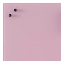 Pink surface with black knobs, featuring a smooth, glossy finish. Stylish minimalist design.