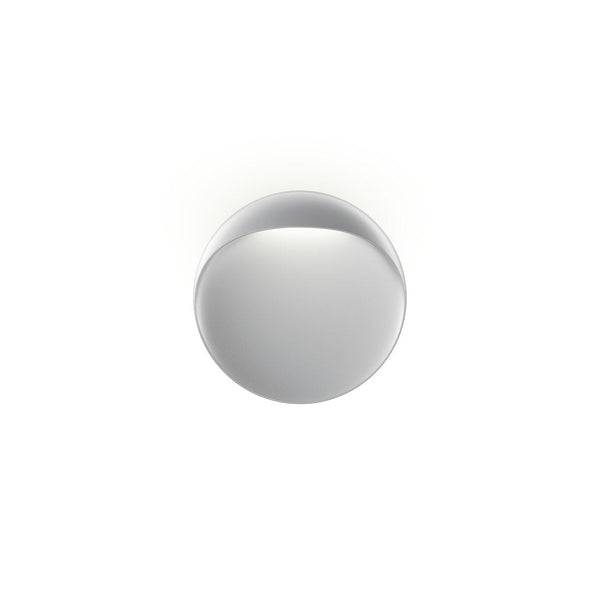 Sleek round mirror with a smooth, reflective silver surface and minimalistic design. Perfect for modern decor.