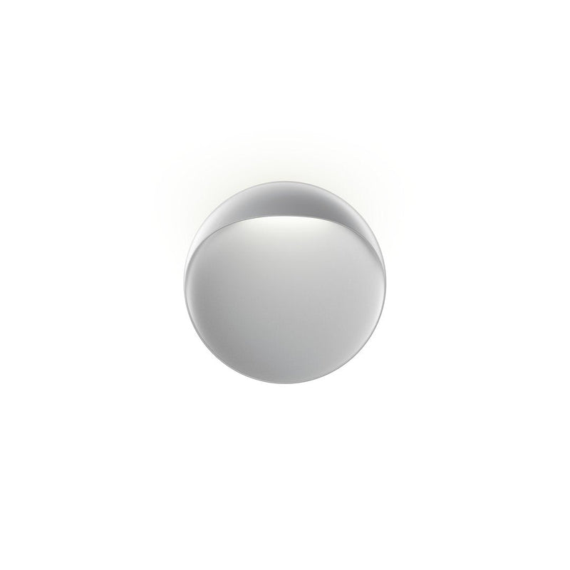Sleek round mirror with a smooth, reflective silver surface and minimalistic design. Perfect for modern decor.