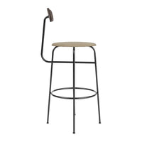 Black metal bar stool with a natural wood seat and curved backrest, offering a sleek, minimalist design.
