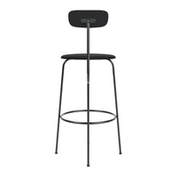 Black bar stool with a minimalist design and sleek metal legs, featuring a smooth, round black seat.