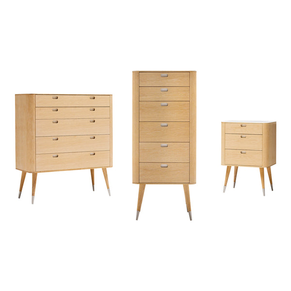 Light wood furniture set featuring a tall chest, wide dresser, and nightstand with sleek silver handles. Modern design.