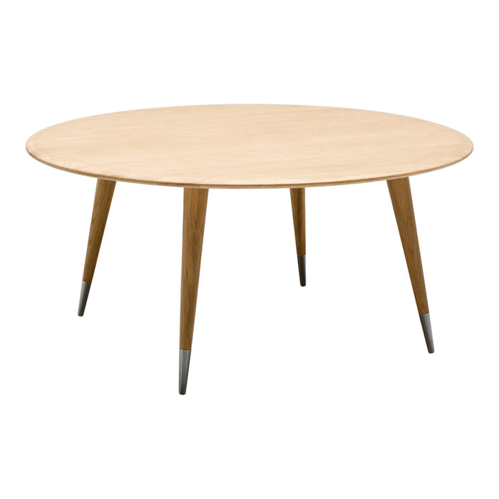 Round wooden table with a light natural finish and tapered legs, featuring subtle metallic accents for a modern touch.