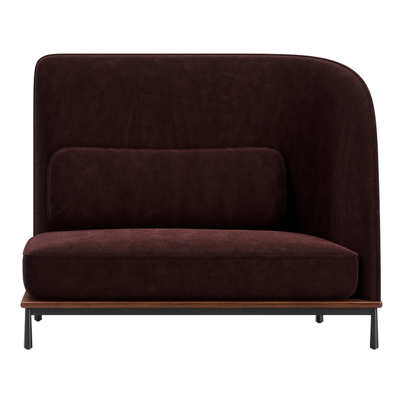 Contemporary burgundy sofa with smooth velvet texture and rounded edges, featuring a sleek black base.