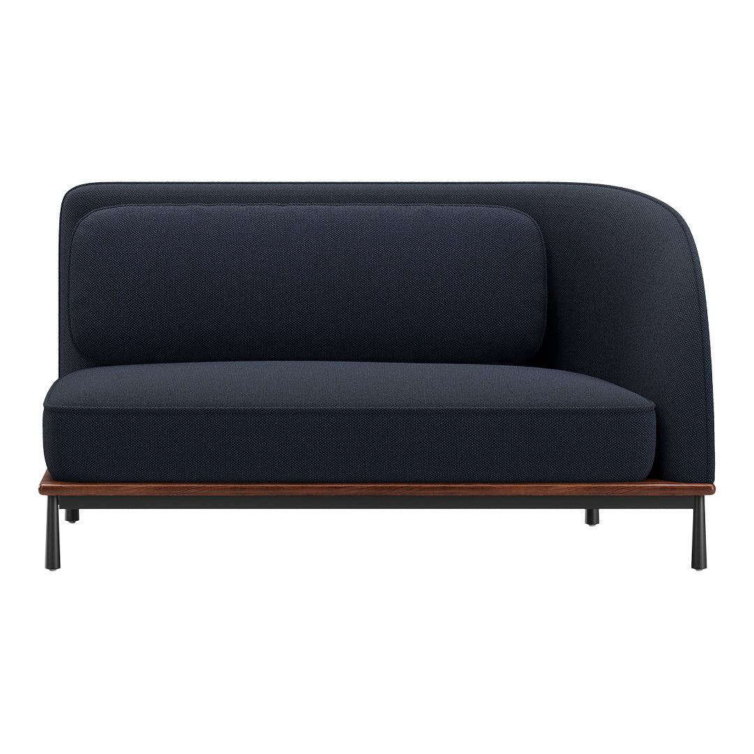Navy blue upholstered sofa with a smooth, textured pattern and a contrasting wood and metal base.