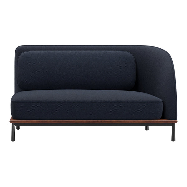 Navy blue upholstered sofa with a smooth, textured pattern and a contrasting wood and metal base.