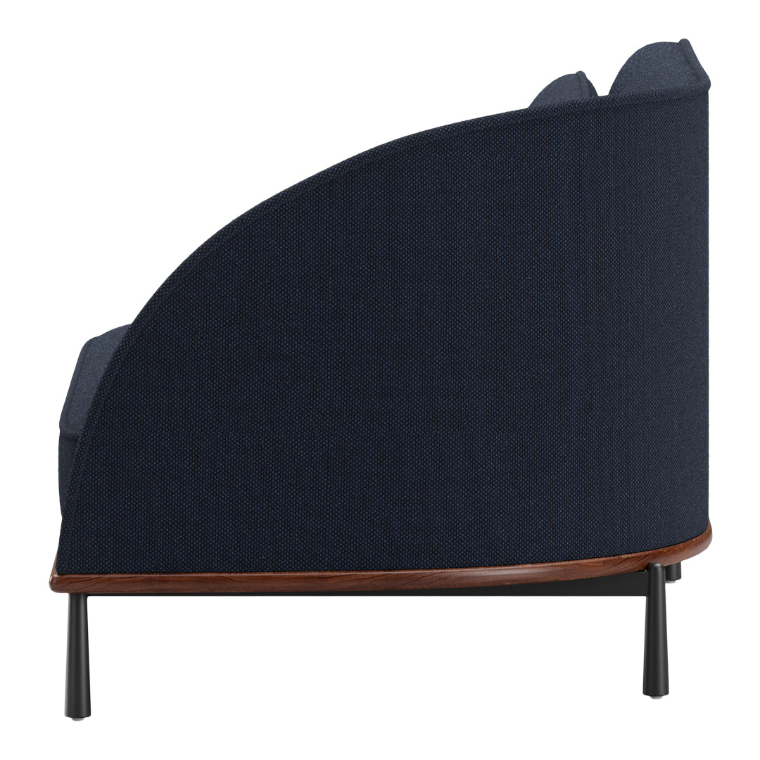 Navy blue textured fabric sofa with a rounded back and contrasting wooden base and black metal legs.