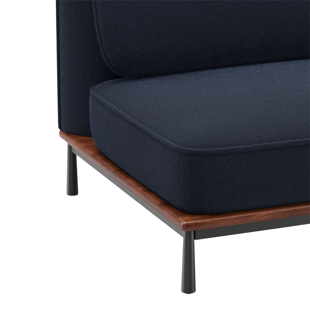 Navy blue upholstery with a textured pattern, complemented by a walnut wood base and black metal legs.