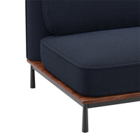 Navy blue upholstery with a textured pattern, complemented by a walnut wood base and black metal legs.