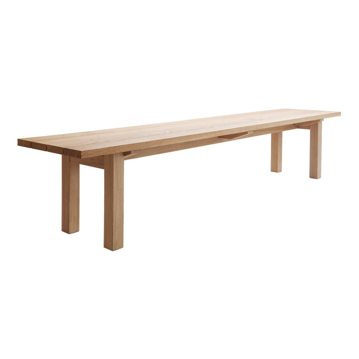 Natural wood bench in light oak finish, featuring a minimalist design with smooth, unblemished surface and simple lines.