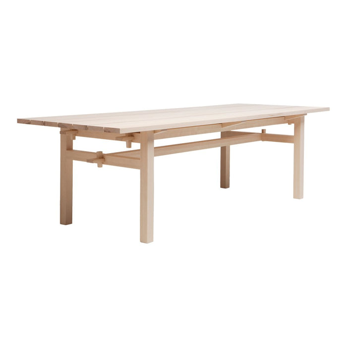 Light natural wood dining table with a simple, clean design and smooth surface, perfect for modern interiors.