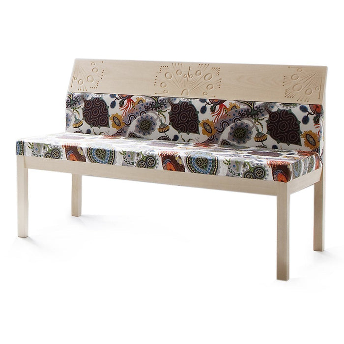 Wooden bench with colorful floral fabric upholstery in vibrant tones of brown, orange, blue, and yellow patterns.