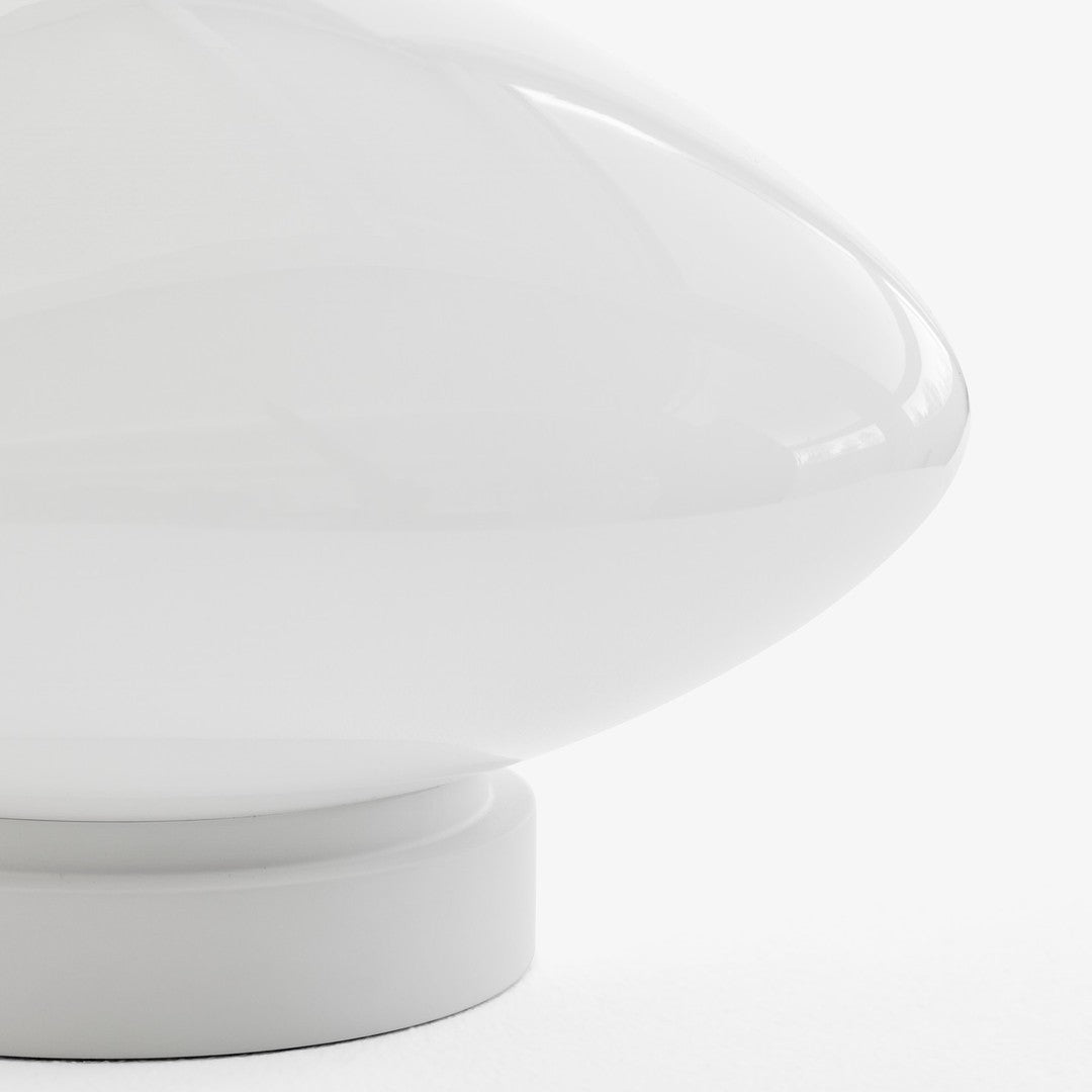 White glossy lamp with a smooth, rounded shape and subtle glossy finish. Perfect for modern decor.