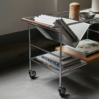 Metal cart with a wooden top, featuring a minimalist design and a mix of gray, silver, and natural wood tones.