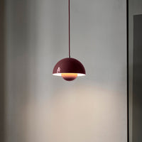 Modern burgundy pendant lamp with white interior, featuring a sleek, minimalist design and smooth finish.