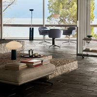 Modern living space with gray tones, natural stone textures, and sleek, minimalist design elements.