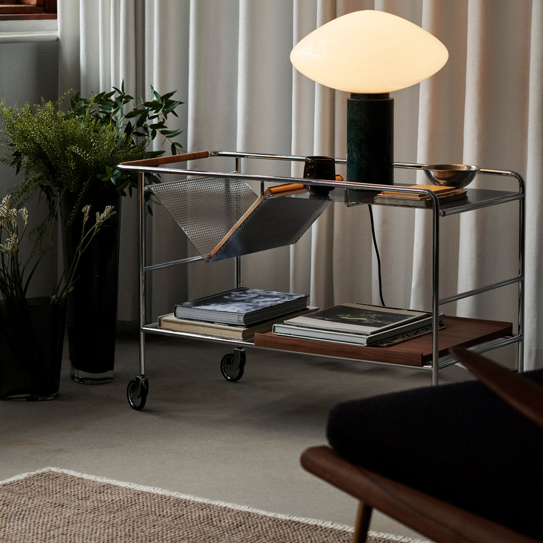 "Modern metal and wood bar cart with natural tones, featuring sleek lines and a minimalist design."