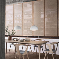Scandinavian dining area featuring neutral tones, soft white pendant lights, and natural wood textures. Cozy and minimalist design.