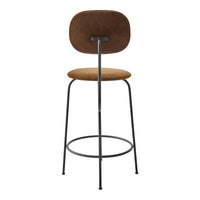 Brown suede bar stool with a minimalist design and black metal frame. Simple, modern aesthetic suitable for any decor.