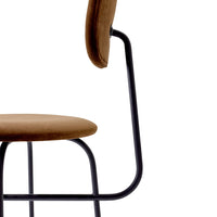 Brown upholstered chair with a sleek black metal frame, showcasing a modern design and minimalistic style.